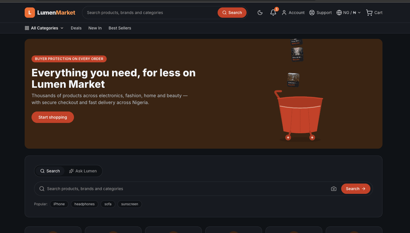 The same Lumen Market storefront in dark mode, the panels and search bar redrawn on a near-black background with the orange brand colour kept for the logo and the primary buttons.